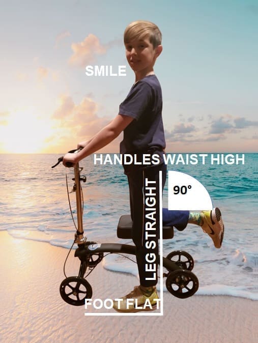 The image shows a child standing on a scooter at a beach during sunset, with labels indicating correct scooter posture. The child is smiling while holding the scooter's handlebars, which are positioned at waist height. Their front leg is straight with the foot flat on the scooter deck, and the back leg is bent at a 90-degree angle with the foot lifted. The labels "SMILE," "HANDLES WAIST HIGH," "LEG STRAIGHT," "FOOT FLAT," and "90°" describe these postural aspects, emphasizing proper form.